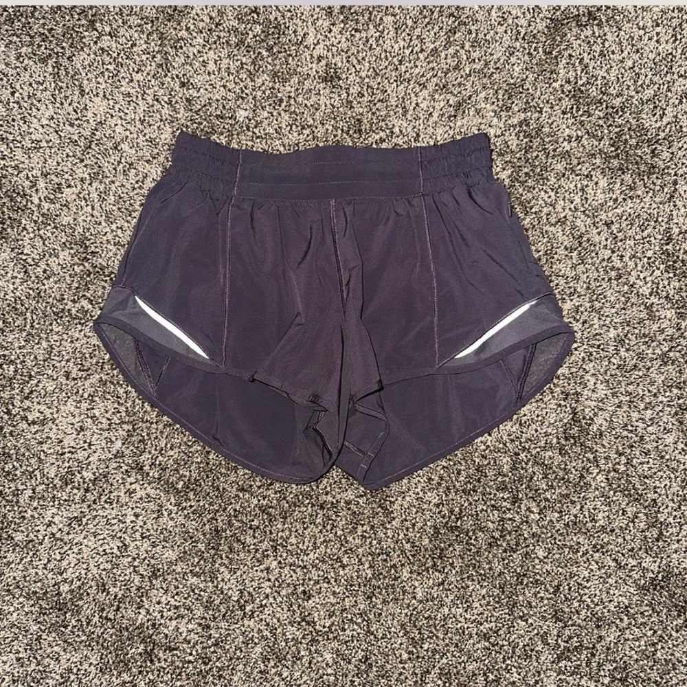 Dark purple lululemon hotty hot lowrise shorts.